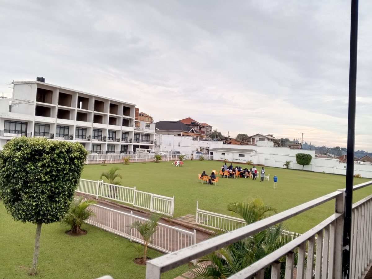The green lawn and white buildings of KK Resort Beach by Lake Victoria, Ggaba