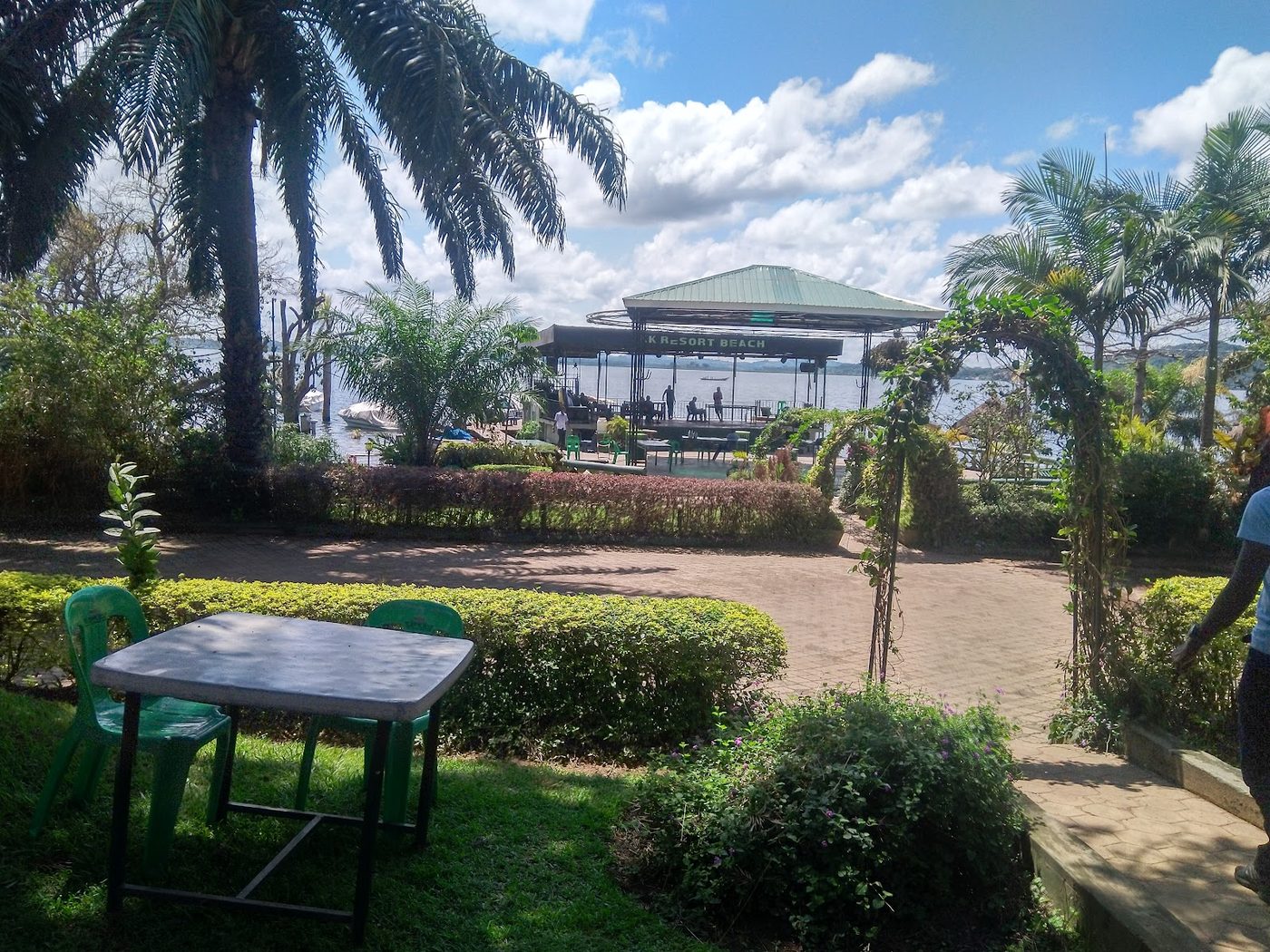Gardens and the K.K Resort Beach stage sign by Lake Victoria at KK Resort, Ggaba